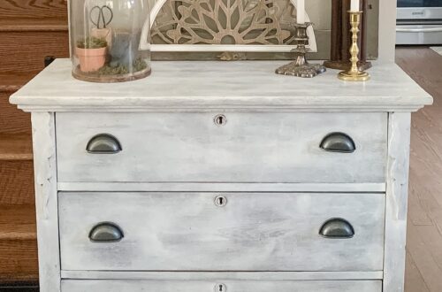 antique wood dresser that has been repainted with white chalk paint