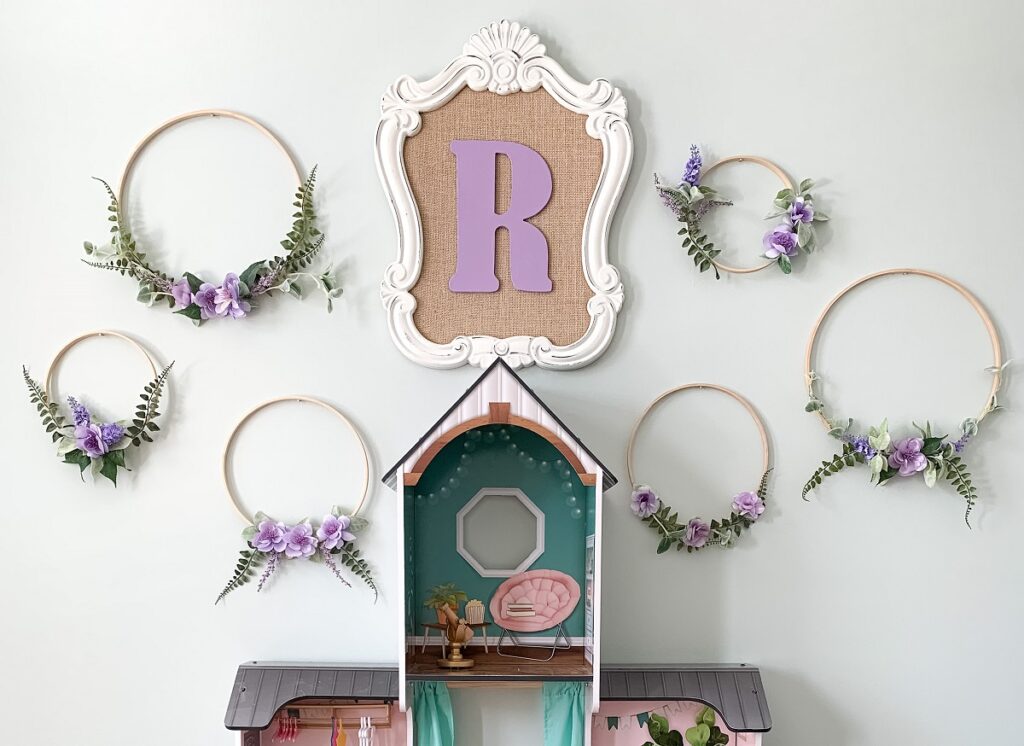 collection of  hoop wreaths on a wall in a little girl's room